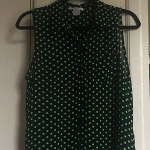 sheer *sleeveless* button-down women’s top